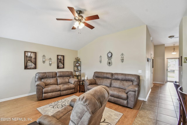 104 Twin Lakes Dr, Saint Augustine, FL 32084 - living area featuring a ceiling fan, vaulted ceiling, wood finished floors, and baseboards