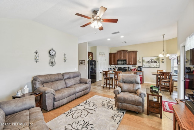 104 Twin Lakes Dr, Saint Augustine, FL 32084 - living area with a ceiling fan, lofted ceiling, a chandelier, and light wood-style floors