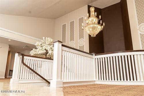 9226 Players Dr, Weeki Wachee, FL 34613 - stairway with a chandelier