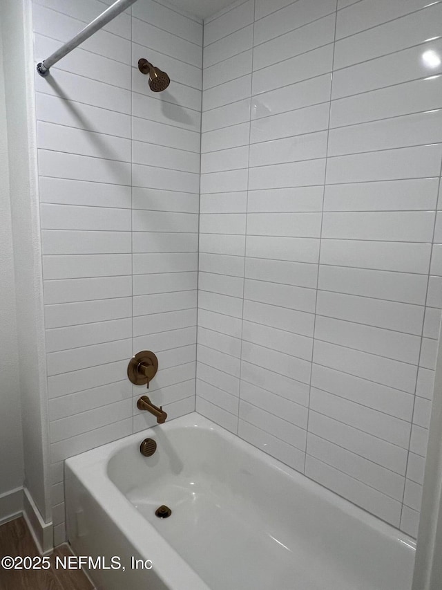 96124 Pirates Bluff Rd, Yulee, FL 32097 - full bathroom featuring shower / bath combination and wood finished floors