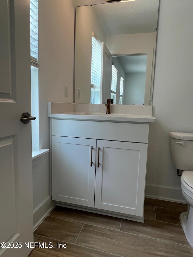96124 Pirates Bluff Rd, Yulee, FL 32097 - half bath with vanity and wood finished floors