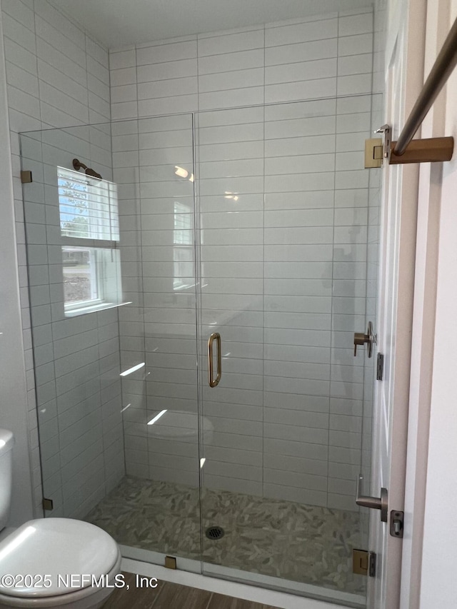 96124 Pirates Bluff Rd, Yulee, FL 32097 - bathroom with a stall shower and wood finished floors