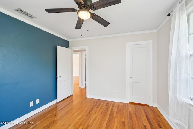 4253 Redwood Ave, Jacksonville, FL 32207 - unfurnished bedroom with baseboards, ornamental molding, light wood finished floors, and ceiling fan