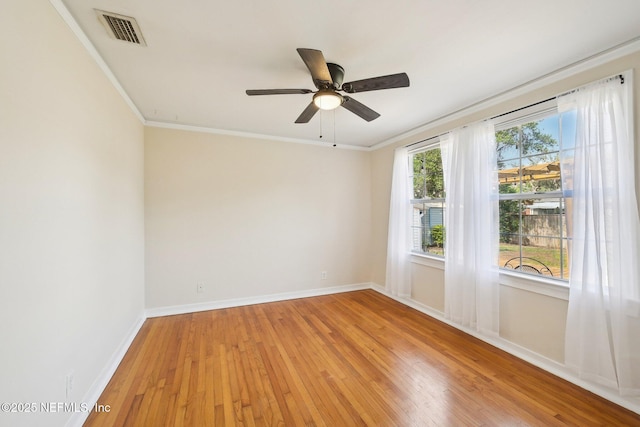 4253 Redwood Ave, Jacksonville, FL 32207 - spare room featuring light wood finished floors, baseboards, ceiling fan, and crown molding