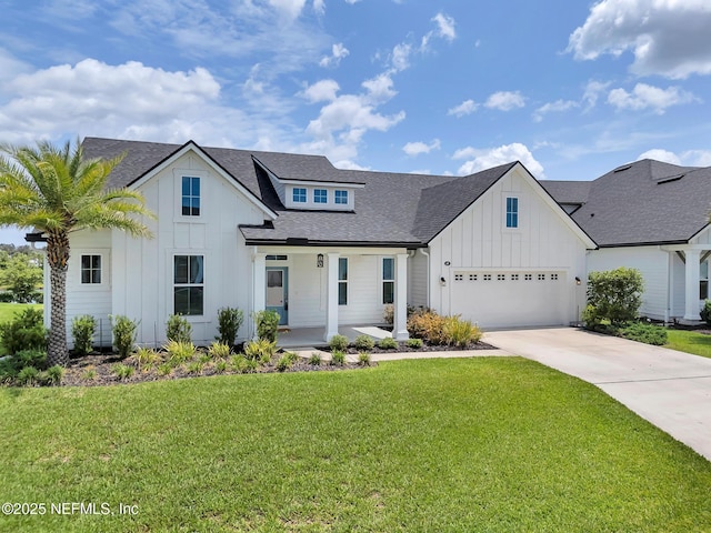 69 Lomond Ct, Saint Augustine, FL 32095 - modern inspired farmhouse featuring board and batten siding, a shingled roof, a front yard, concrete driveway, and covered porch