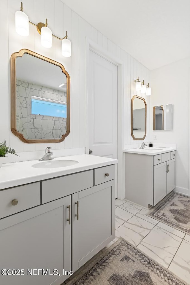 9789 Intellect Trl, Jacksonville, FL 32256 - full bath with marble look tile flooring and two vanities