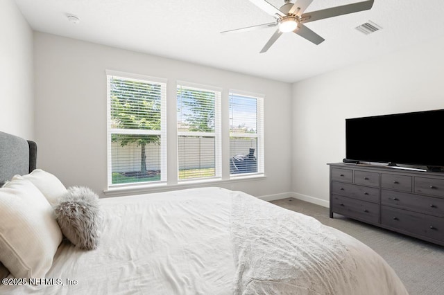 9789 Intellect Trl, Jacksonville, FL 32256 - bedroom featuring light carpet, baseboards, and ceiling fan