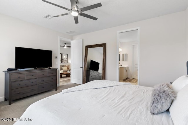 9789 Intellect Trl, Jacksonville, FL 32256 - bedroom with ensuite bathroom, light colored carpet, and ceiling fan