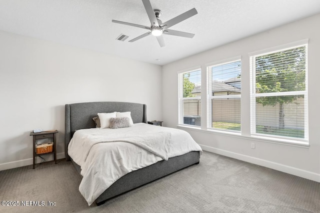 9789 Intellect Trl, Jacksonville, FL 32256 - bedroom with baseboards, carpet floors, and ceiling fan