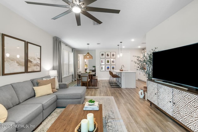 9789 Intellect Trl, Jacksonville, FL 32256 - living area with light wood-style flooring, ceiling fan, recessed lighting, and baseboards