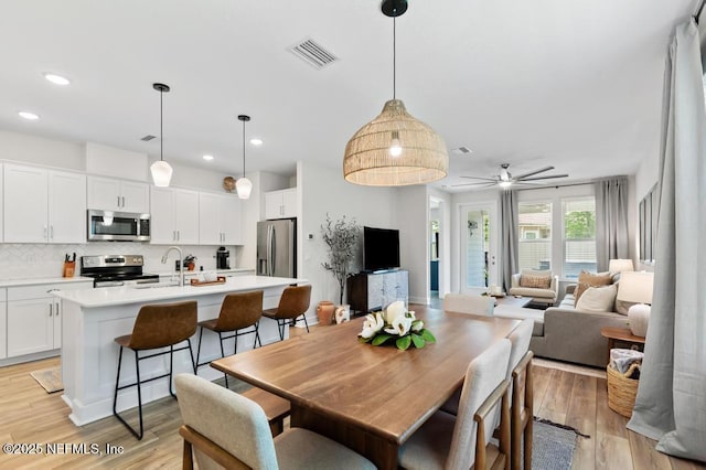 9789 Intellect Trl, Jacksonville, FL 32256 - dining space featuring recessed lighting, light wood finished floors, and a ceiling fan