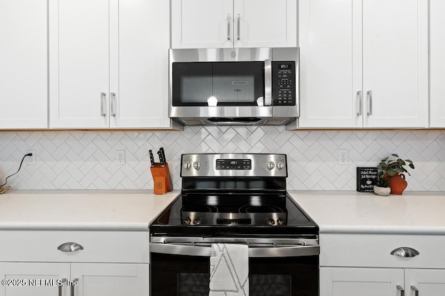 9789 Intellect Trl, Jacksonville, FL 32256 - kitchen with stainless steel appliances, white cabinetry, and light countertops