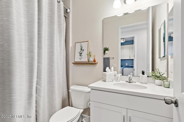 9789 Intellect Trl, Jacksonville, FL 32256 - bathroom featuring vanity, toilet, and a shower with shower curtain