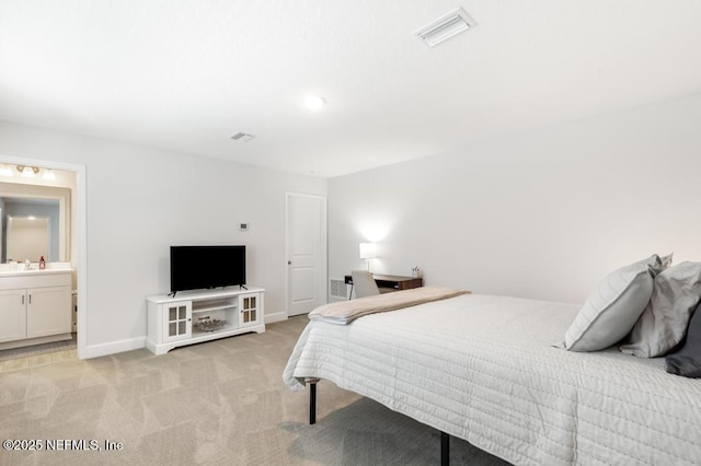 9789 Intellect Trl, Jacksonville, FL 32256 - bedroom with light colored carpet, baseboards, and a sink