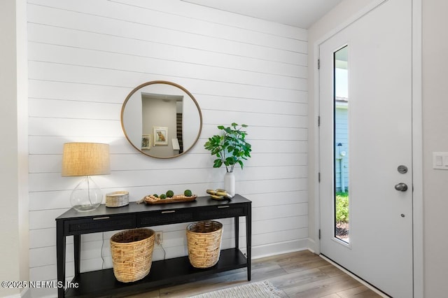9789 Intellect Trl, Jacksonville, FL 32256 - entrance foyer featuring light wood finished floors, wooden walls, and baseboards