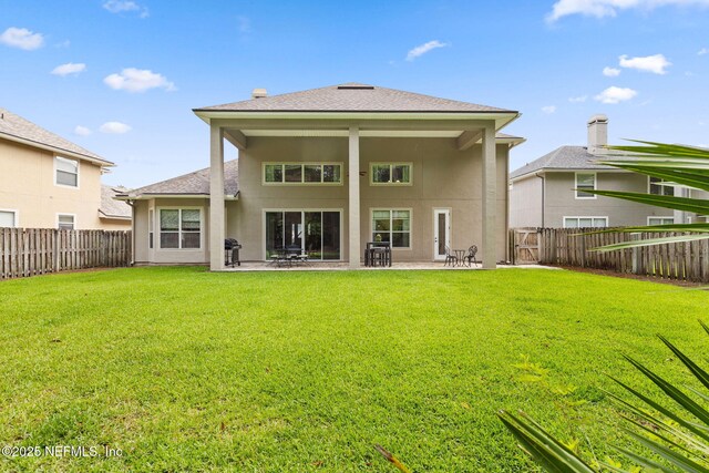 1159 Eastwood Branch Dr, Saint Johns, FL 32259 - rear view of house featuring a patio, stucco siding, and roof with shingles
