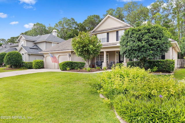 1159 Eastwood Branch Dr, Saint Johns, FL 32259 - view of front of house with a front yard, an attached garage, driveway, covered porch, and stucco siding