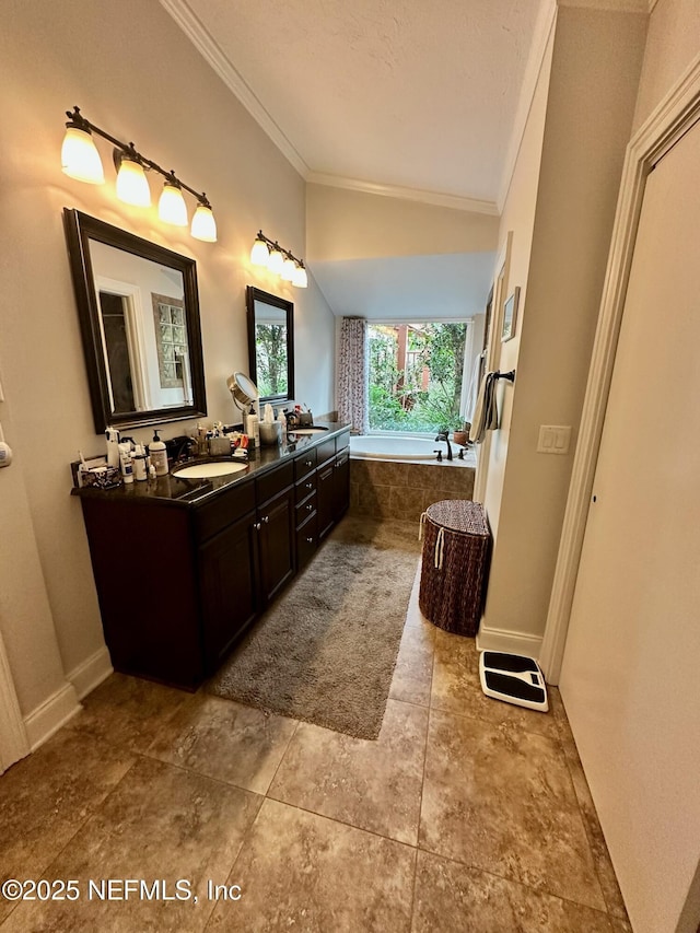 4026 Corrientes Ct E, Jacksonville, FL 32217 - full bathroom with crown molding, double vanity, a garden tub, and baseboards
