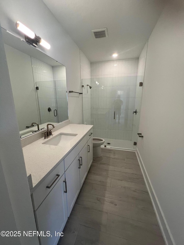 96088 Pirates Bluff Rd, Yulee, FL 32097 - full bath with vanity, a stall shower, and wood finished floors