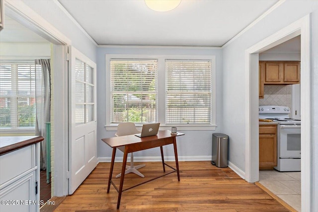4651 Pinewood Ave, Jacksonville, FL 32207 - office area with crown molding, plenty of natural light, light wood-type flooring, and baseboards