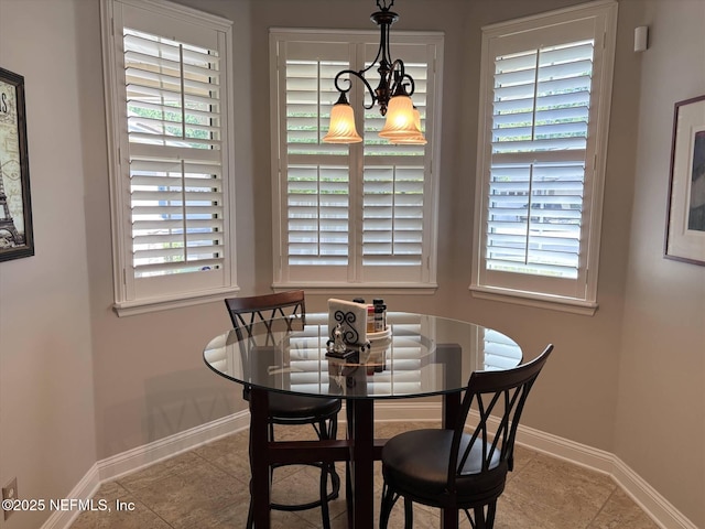 501 N Legacy Trl, Saint Augustine, FL 32092 - tiled dining space with baseboards and a chandelier