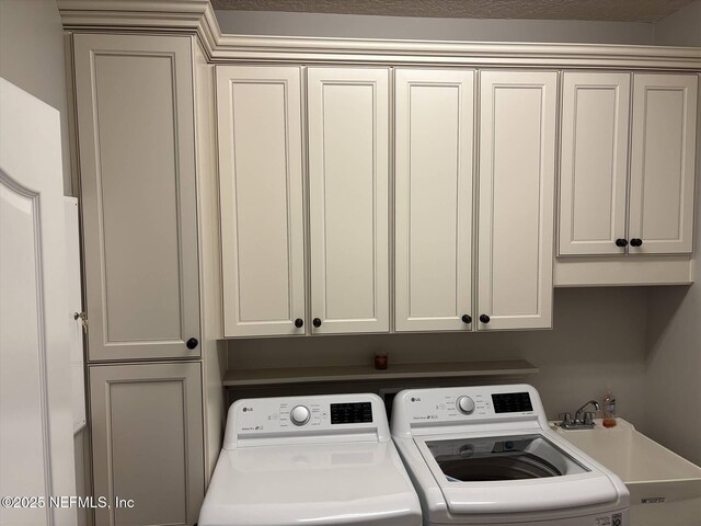 501 N Legacy Trl, Saint Augustine, FL 32092 - washroom featuring washer and clothes dryer and cabinet space