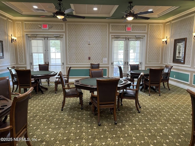 501 N Legacy Trl, Saint Augustine, FL 32092 - carpeted dining space with french doors, a ceiling fan, ornamental molding, a decorative wall, and healthy amount of natural light