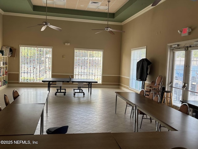 501 N Legacy Trl, Saint Augustine, FL 32092 - playroom featuring a ceiling fan, a towering ceiling, baseboards, tile patterned flooring, and ornamental molding