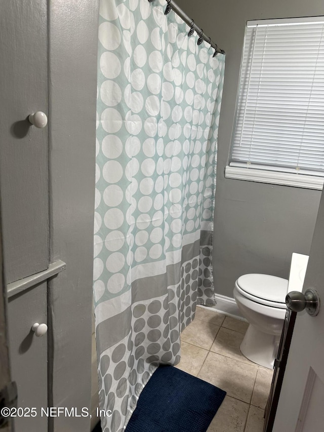 4040 Shasta Dr, Jacksonville, FL 32207 - bathroom with toilet, tile patterned floors, a shower with shower curtain, and vanity