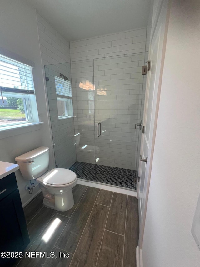96100 Pirates Bluff Rd, Yulee, FL 32097 - bathroom featuring wood tiled floors, vanity, and a stall shower