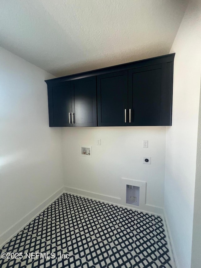 96100 Pirates Bluff Rd, Yulee, FL 32097 - laundry room featuring electric dryer hookup, cabinet space, washer hookup, and a textured ceiling