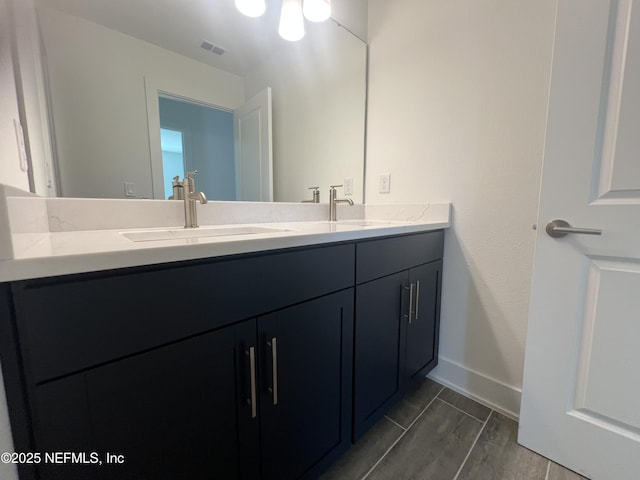 96100 Pirates Bluff Rd, Yulee, FL 32097 - bathroom with double vanity and baseboards