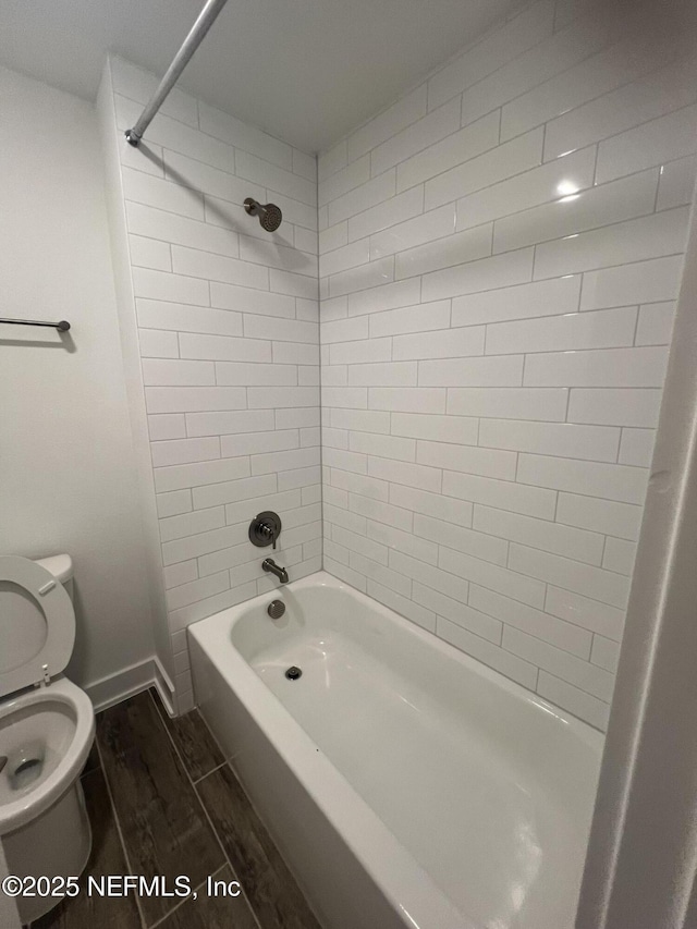 96100 Pirates Bluff Rd, Yulee, FL 32097 - bathroom featuring wood finished floors and shower / tub combination