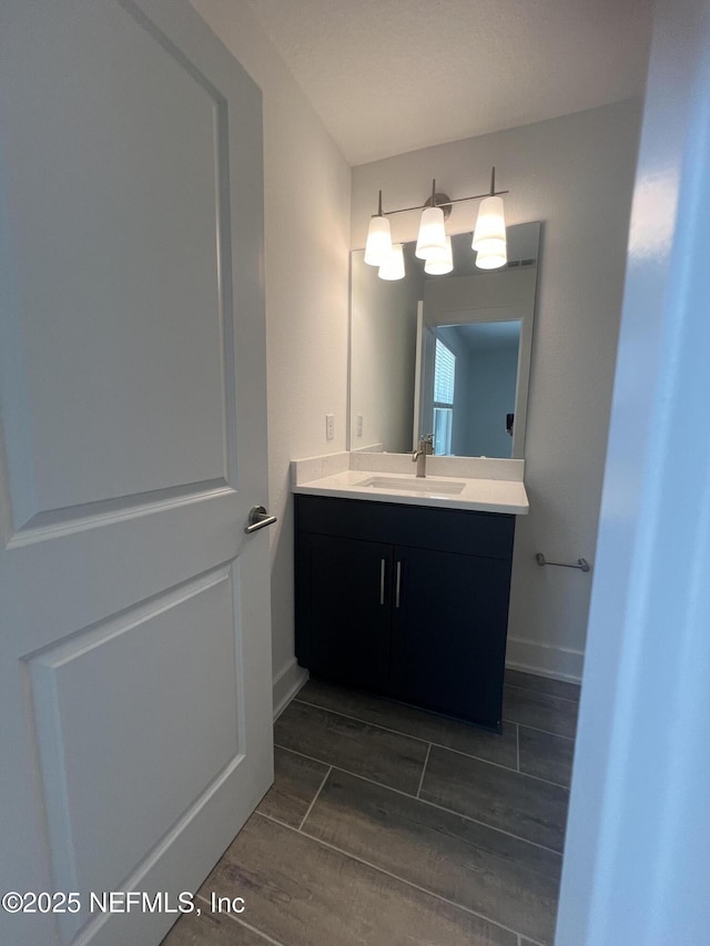 96100 Pirates Bluff Rd, Yulee, FL 32097 - bathroom featuring vanity and wood finish floors