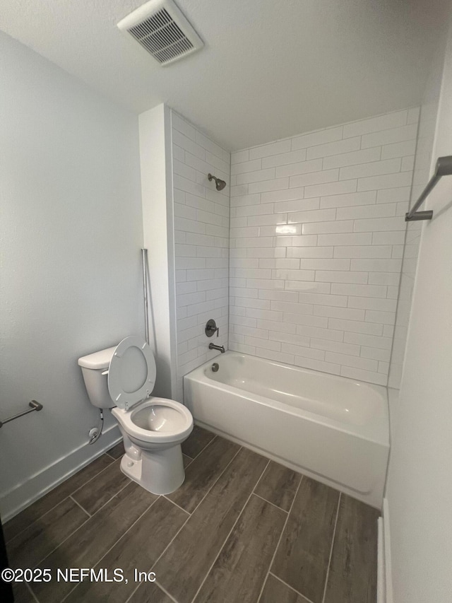 96100 Pirates Bluff Rd, Yulee, FL 32097 - bathroom featuring wood tiled floors and tub / shower combination
