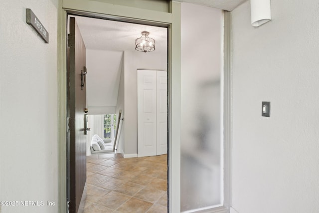 1165 Beach Walker Rd, Fernandina Beach, FL 32034 - corridor with a chandelier and baseboards