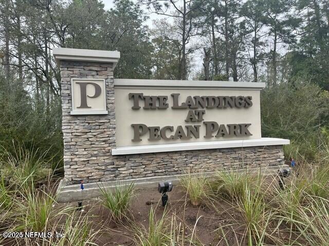 14872 Praline Ct Unit 199, Jacksonville, FL 32218 - community sign featuring view of scattered trees