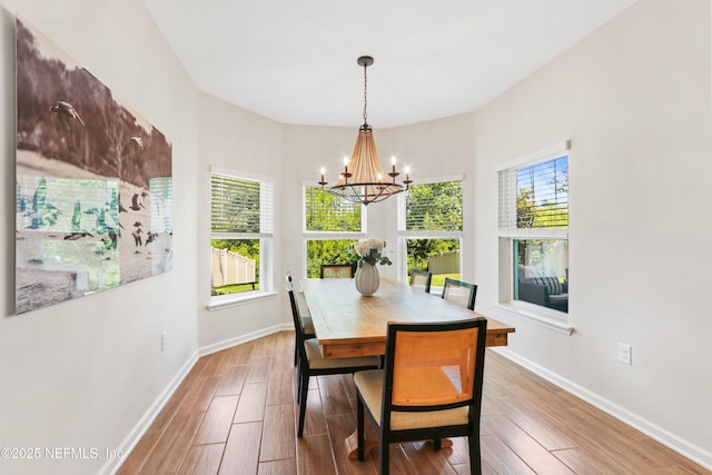 264 Windermere Way, Saint Augustine, FL 32095 - dining room with a chandelier, baseboards, and wood finished floors