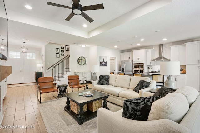 264 Windermere Way, Saint Augustine, FL 32095 - living room featuring stairway, a ceiling fan, recessed lighting, light wood-style floors, and a textured ceiling