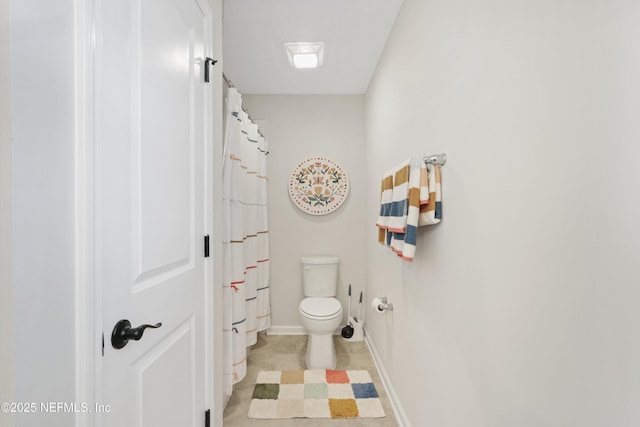 264 Windermere Way, Saint Augustine, FL 32095 - bathroom with toilet, tile patterned floors, baseboards, and curtained shower
