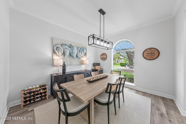 6547 Burnham Cir, Ponte Vedra Beach, FL 32082 - dining room featuring ornamental molding, baseboards, and wood finished floors