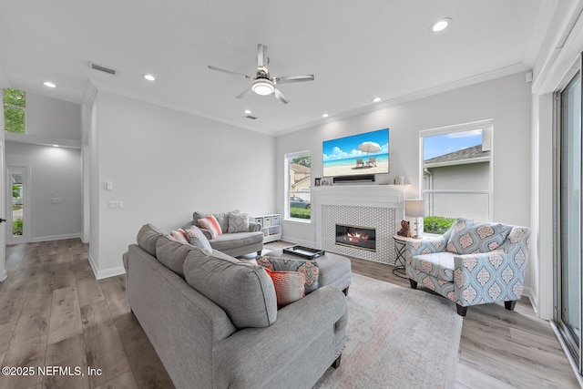 6547 Burnham Cir, Ponte Vedra Beach, FL 32082 - living area featuring healthy amount of natural light, wood finished floors, crown molding, a fireplace, and ceiling fan
