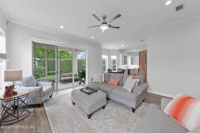 6547 Burnham Cir, Ponte Vedra Beach, FL 32082 - living room featuring crown molding, wood finished floors, a ceiling fan, recessed lighting, and baseboards