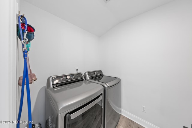 6547 Burnham Cir, Ponte Vedra Beach, FL 32082 - laundry area with washer and dryer, wood finished floors, and baseboards