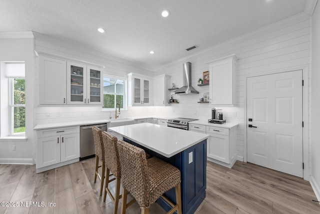 6547 Burnham Cir, Ponte Vedra Beach, FL 32082 - kitchen featuring stainless steel appliances, healthy amount of natural light, crown molding, white cabinets, and recessed lighting