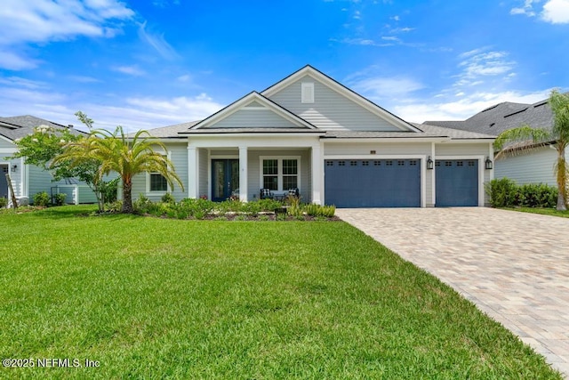 638 Windley Dr, Saint Augustine, FL 32092 - ranch-style house featuring a garage, decorative driveway, a front lawn, and a shingled roof