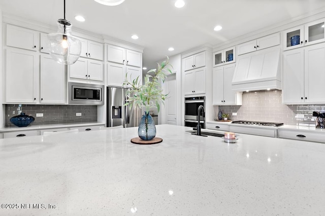 638 Windley Dr, Saint Augustine, FL 32092 - kitchen featuring stainless steel appliances, a sink, recessed lighting, backsplash, and white cabinets