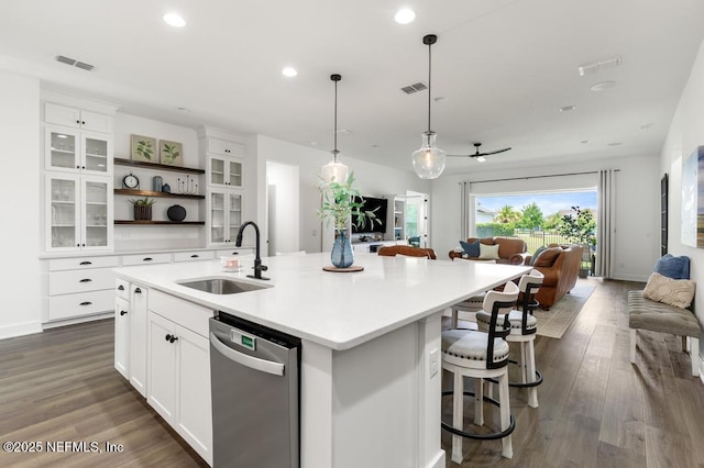 638 Windley Dr, Saint Augustine, FL 32092 - kitchen featuring dishwasher, a sink, open shelves, open floor plan, and a kitchen island with sink