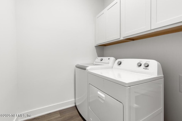 638 Windley Dr, Saint Augustine, FL 32092 - laundry area with washer and clothes dryer, cabinet space, dark wood finished floors, and baseboards