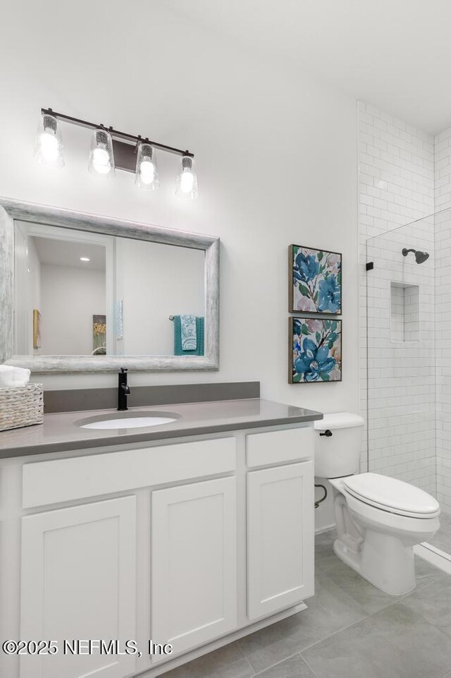 638 Windley Dr, Saint Augustine, FL 32092 - full bath with vanity, toilet, a tile shower, and tile patterned floors